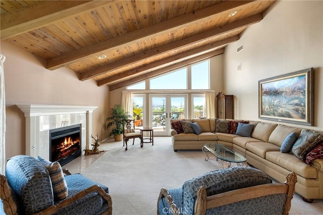 living area featuring carpet flooring, beam ceiling, and wood ceiling