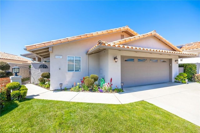 view of front facade featuring a front lawn, stucco siding, a gate, concrete driveway, and an attached garage