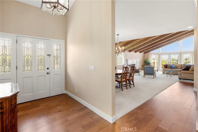 1057 Ridge Heights Dr, Fallbrook, CA 92028 - foyer with a chandelier, wood finished floors, high vaulted ceiling, baseboards, and beamed ceiling