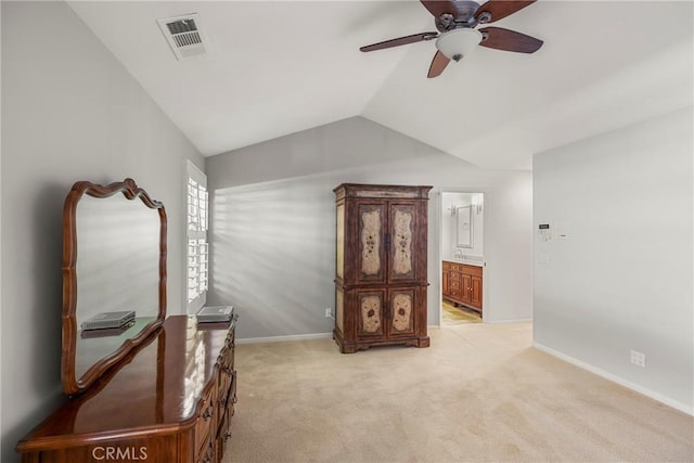 interior space featuring ceiling fan, light carpet, baseboards, lofted ceiling, and visible vents