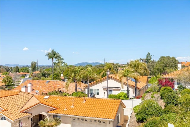 drone / aerial view featuring a mountain view and a residential view