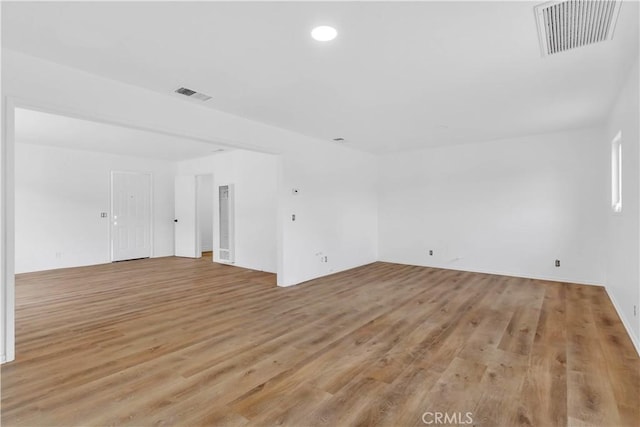 7307 Diamond St, Riverside, CA 92504 - empty room with recessed lighting, visible vents, and light wood-style floors