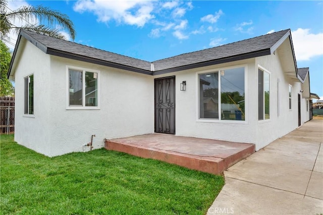 7307 Diamond St, Riverside, CA 92504 - view of front of house with stucco siding, fence, and a front yard