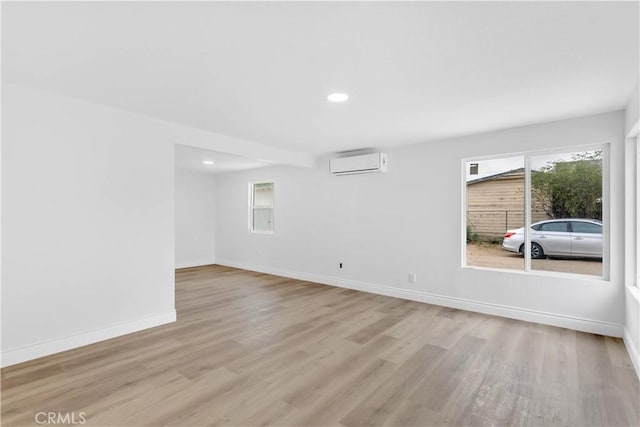 7307 Diamond St, Riverside, CA 92504 - interior space featuring recessed lighting, an AC wall unit, baseboards, and wood finished floors
