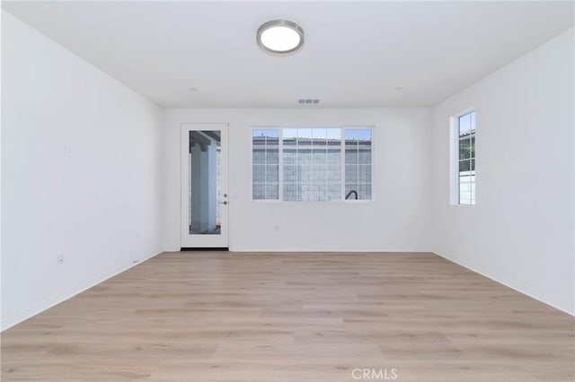 4021 E Perdido Privado, Ontario, CA 91761 - unfurnished room with baseboards, visible vents, and light wood-style floors