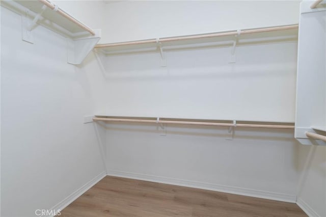 4021 E Perdido Privado, Ontario, CA 91761 - walk in closet with wood finished floors