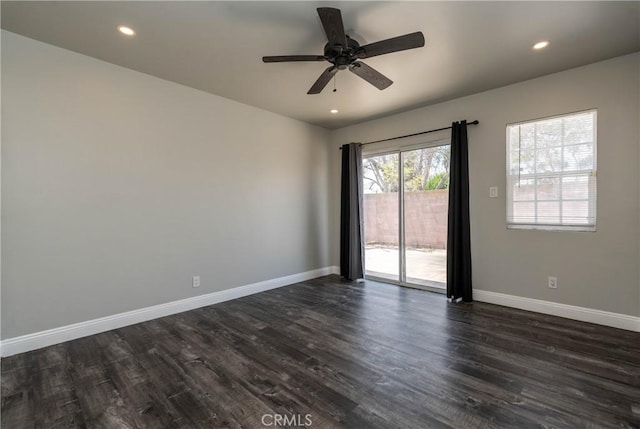 empty room with a ceiling fan, baseboards, dark wood finished floors, and recessed lighting