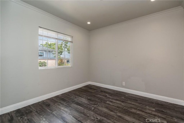 empty room featuring crown molding, baseboards, dark wood-style flooring, and recessed lighting