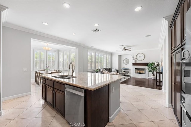 kitchen featuring a sink, stainless steel dishwasher, a ceiling fan, crown molding, and dark brown cabinetry