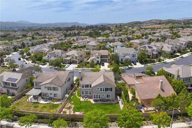 aerial view of residential area with mountains