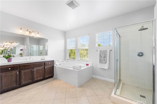full bathroom featuring a stall shower, vanity, tile patterned floors, and a garden tub