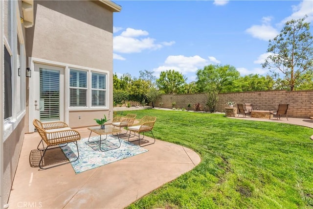 view of yard featuring a patio and an outdoor living space with a fire pit