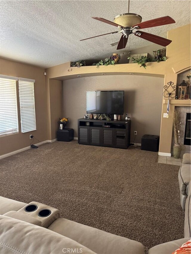17815 Chestnut St, Hesperia, CA 92345 - living room featuring ceiling fan, carpet flooring, baseboards, and a textured ceiling