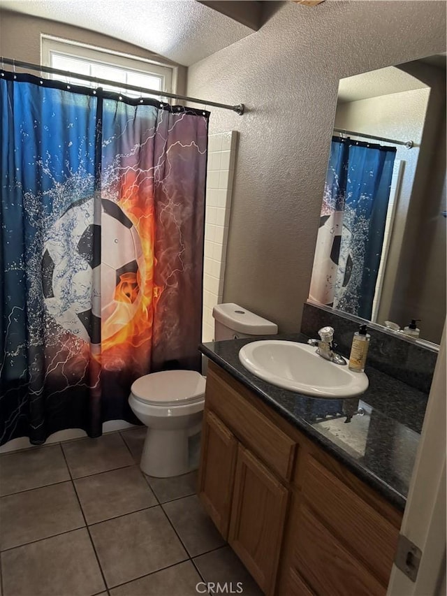 17815 Chestnut St, Hesperia, CA 92345 - bathroom with a textured wall, tile patterned floors, a textured ceiling, vanity, and toilet
