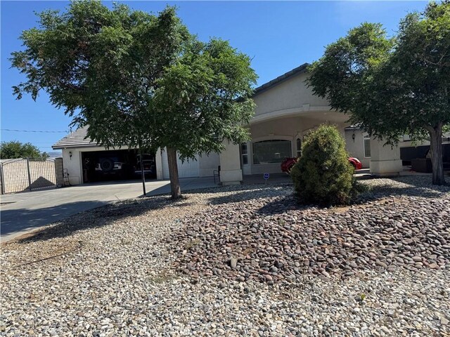 17815 Chestnut St, Hesperia, CA 92345 - view of front of house featuring concrete driveway, stucco siding, and an attached garage