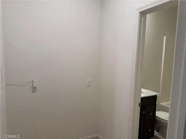 bathroom with toilet and vanity