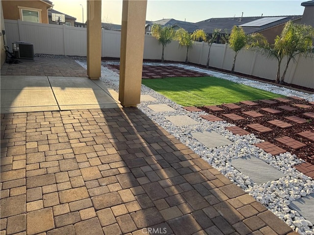 view of patio / terrace featuring a fenced backyard and central AC unit