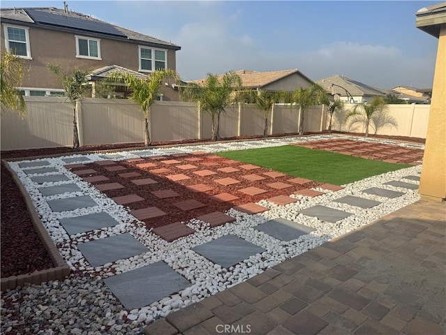 view of yard featuring a fenced backyard and a patio