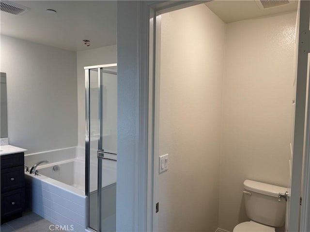 bathroom featuring a garden tub, visible vents, a shower stall, vanity, and toilet