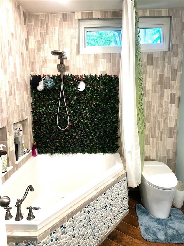 3324 Columbia Ave, Merced, CA 95340 - bathroom with wood finished floors, tiled shower / bath combo, and toilet