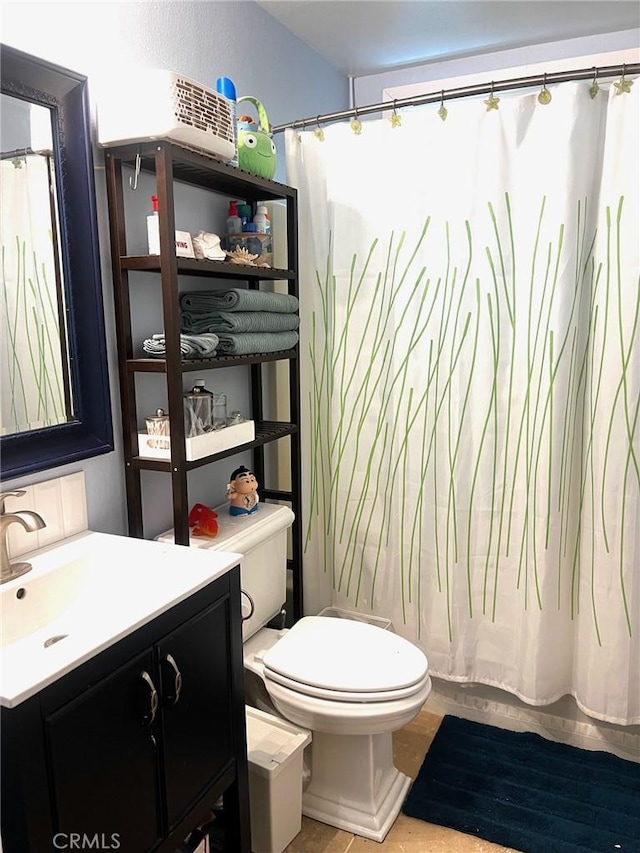 3324 Columbia Ave, Merced, CA 95340 - full bath featuring vanity, a shower with shower curtain, and toilet