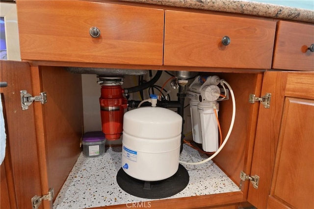 room details with light countertops and brown cabinetry