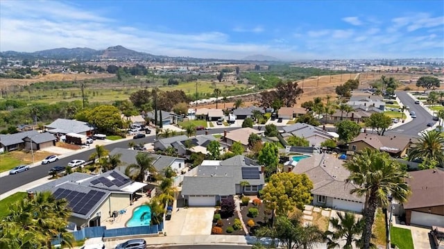 birds eye view of property with a residential view and a mountain view