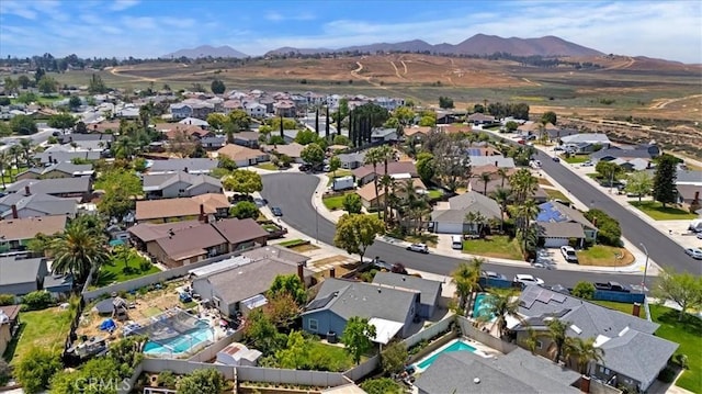 birds eye view of property featuring a mountain view and a residential view