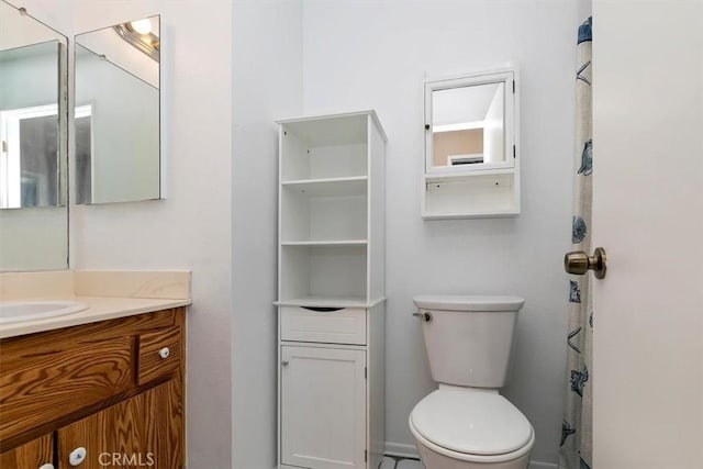 bathroom featuring vanity and toilet
