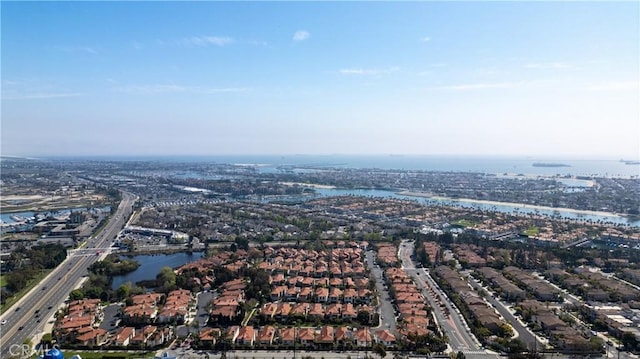 bird's eye view featuring a residential view and a water view