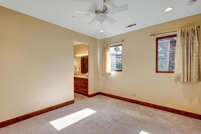 unfurnished room featuring ceiling fan, light carpet, recessed lighting, baseboards, and visible vents