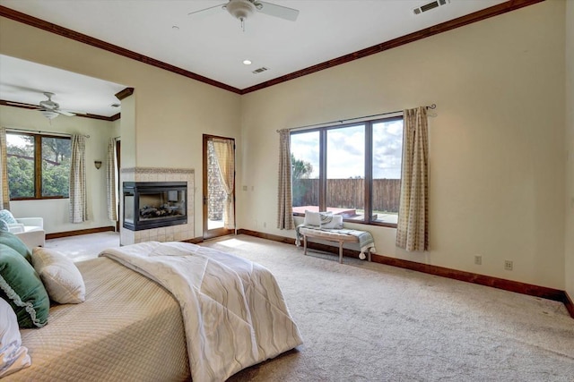 carpeted bedroom with baseboards, access to outside, ceiling fan, and visible vents
