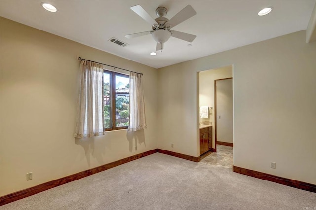 unfurnished room with visible vents, baseboards, recessed lighting, light colored carpet, and a ceiling fan