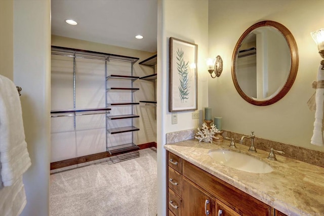 bathroom with vanity and recessed lighting