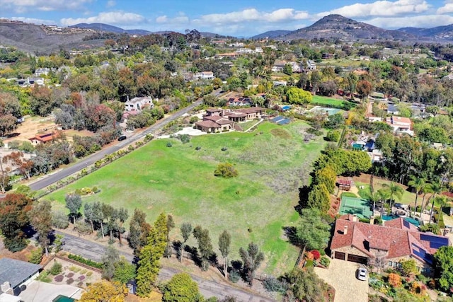 birds eye view of property with a residential view and a mountain view