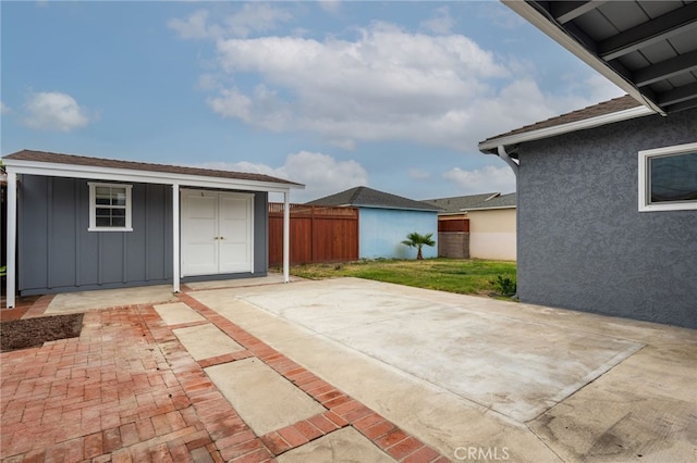 4744 Adenmoor Ave, Lakewood, CA 90713 - view of patio featuring fence, a storage unit, and an outdoor structure