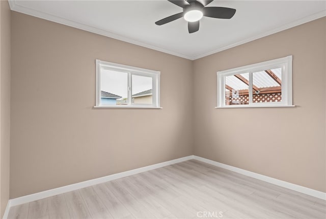 4744 Adenmoor Ave, Lakewood, CA 90713 - empty room with crown molding, a healthy amount of sunlight, and light wood-type flooring