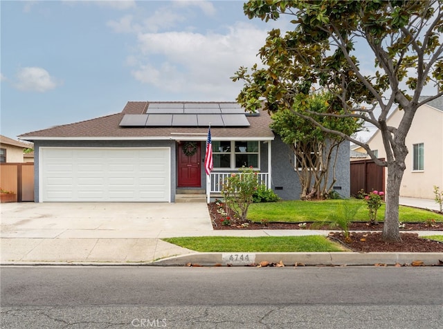 4744 Adenmoor Ave, Lakewood, CA 90713 - view of front facade featuring a garage, fence, covered porch, driveway, and solar panels