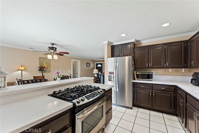 14901 Quill Cir, Huntington Beach, CA 92647 - kitchen featuring stainless steel appliances, light countertops, dark brown cabinetry, a ceiling fan, and light tile patterned floors