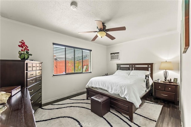 14901 Quill Cir, Huntington Beach, CA 92647 - bedroom featuring wood finished floors, crown molding, an AC wall unit, a textured ceiling, and baseboards