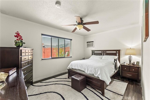 14901 Quill Cir, Huntington Beach, CA 92647 - bedroom with wood finished floors, ornamental molding, a wall unit AC, a textured ceiling, and baseboards