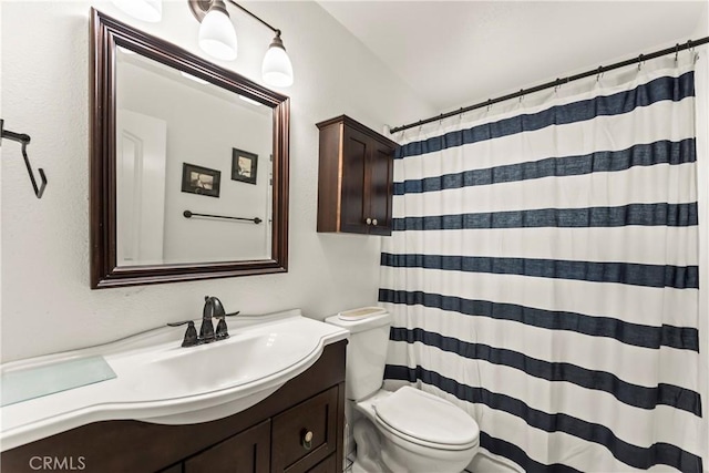 14901 Quill Cir, Huntington Beach, CA 92647 - full bathroom featuring toilet, vanity, and a shower with shower curtain