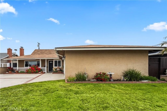 14901 Quill Cir, Huntington Beach, CA 92647 - rear view of property featuring stucco siding and a chimney