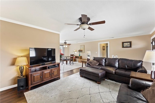14901 Quill Cir, Huntington Beach, CA 92647 - living room with light wood-type flooring, a ceiling fan, crown molding, and baseboards