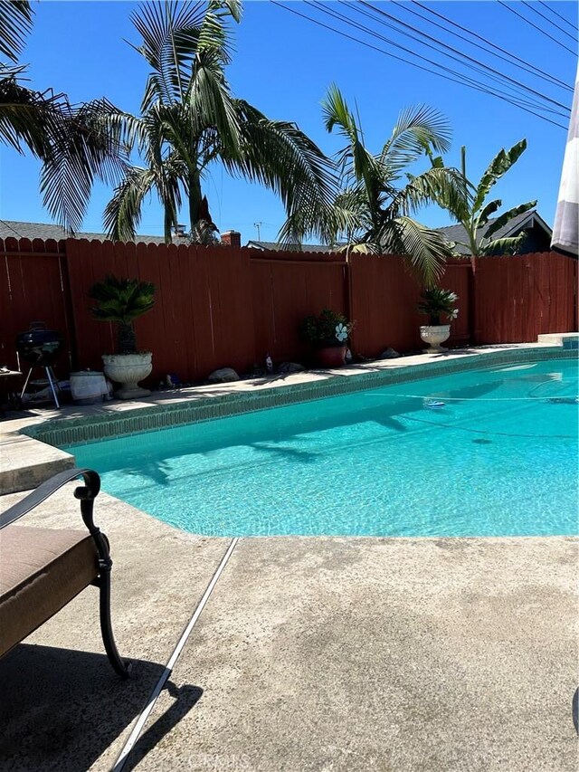 14901 Quill Cir, Huntington Beach, CA 92647 - view of pool with a fenced backyard and a grill