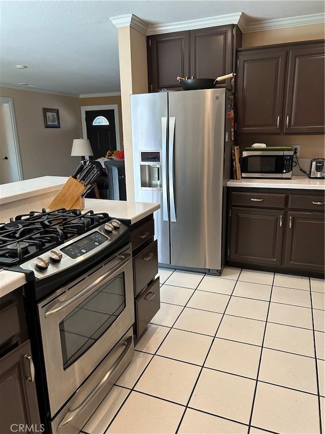 14901 Quill Cir, Huntington Beach, CA 92647 - kitchen with appliances with stainless steel finishes, light countertops, ornamental molding, light tile patterned floors, and dark brown cabinets