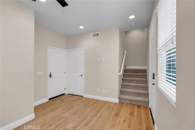 137 Macintosh Way, Upland, CA 91786 - empty room with light wood-style floors, baseboards, stairs, and visible vents