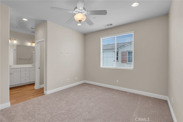 137 Macintosh Way, Upland, CA 91786 - unfurnished bedroom featuring visible vents, baseboards, ensuite bathroom, light colored carpet, and recessed lighting