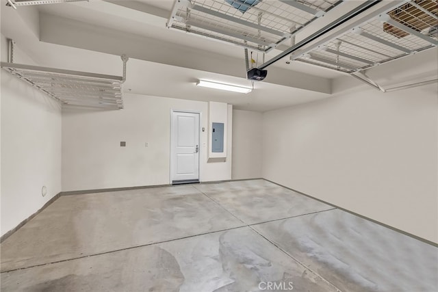 garage with baseboards, a garage door opener, and electric panel
