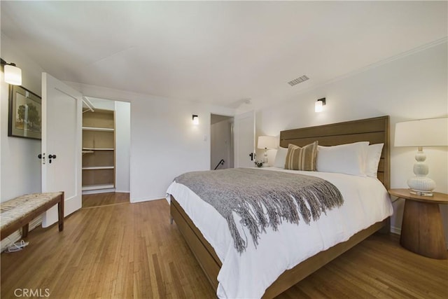 516 E Stocker St, Glendale, CA 91207 - bedroom with wood finished floors, baseboards, and a spacious closet